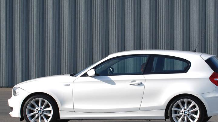 Side Pose Of BMW 1 Series 3 Door In White